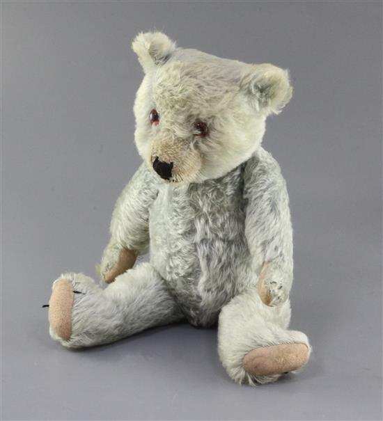 A 1930s blue Chiltern teddy bear, faded, 20in.